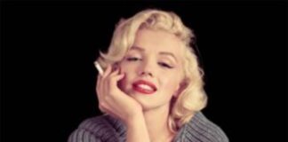 Marilyn Monroe, un secolo di fascino e mistero Foto di Marilyn Monroe sorridente con una sigaretta in mano